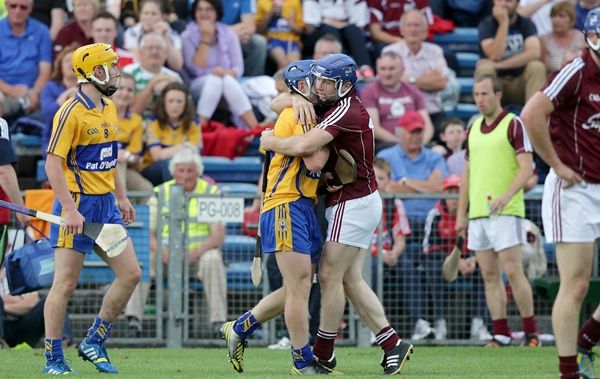 Damien Hayes gives Padraic Collins a hug during the middle of the game 28/7/2013