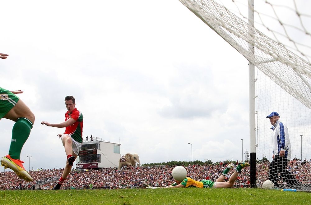 Cillian O'Connor scores his sides fourth goal despite goalkeeper Declan Traynor 21/7/2013