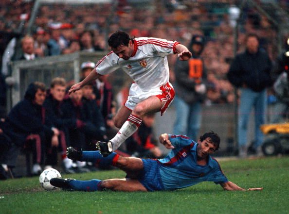 Football. UEFA Cup Winners Cup Final. Rotterdam, Holland. 15th May 1991. Manchester United 2 v Barcelona 1. Manchester United's Brian McClair hurdles a challenge from Barcelona's Aitor Beguiristain.