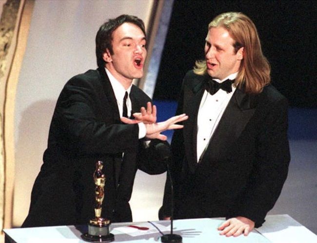 LOS ANGELES, CA - MARCH 27: Co-writers Quentin Tarantino (L) and Roger Avary accept the Oscar award for best original screenplay for the film "Pulp Fiction" at the 67th Annual Academy Awards 27 March 1995 in Los Angeles. Tarantino also directed the film. AFP PHOTO (Photo credit should read DON EMMERT/AFP/Getty Images)