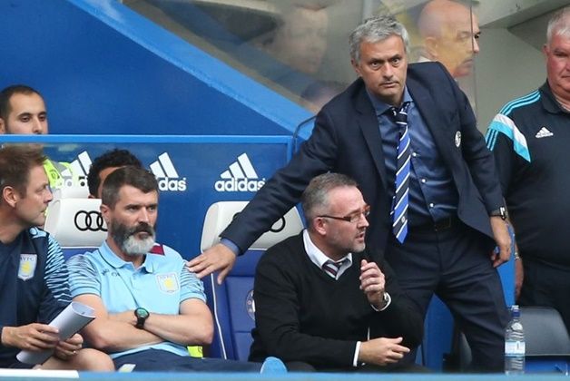 Chelsea manager Mourinho touches Aston Villa Roy Keane on the shoulder during their English Premier League soccer match at Stamford Bridge in London