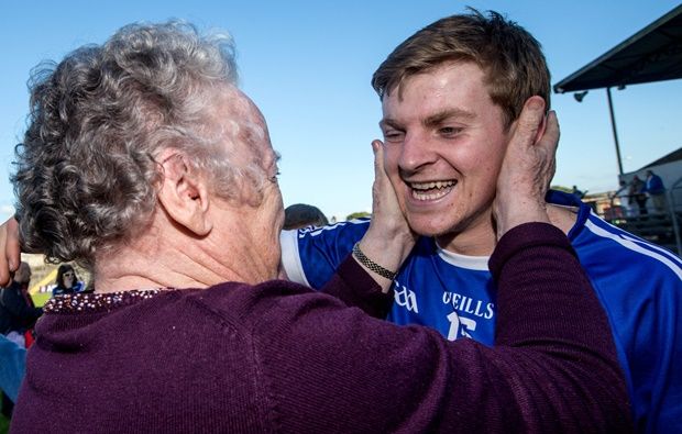 Padraic Collins celebrates with his granny Annette Collins after the game 12/10/2014