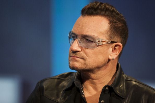 NEW YORK, NY - SEPTEMBER 24: Bono, lead singer of U2 during a panel discussion at the Clinton Global Initiative (CGI) meeting on September 24, 2013 in New York City. Timed to coincide with the United Nations General Assembly, CGI brings together heads of state, CEOs, philanthropists and others to help find solutions to the world's major problems.  (Photo by Ramin Talaie/Getty Images)