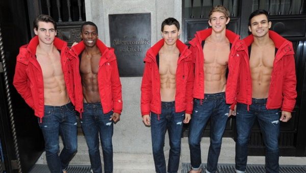 MUNICH, GERMANY - OCTOBER 25:  Male models pose outside the Abercrombie & Fitch flagship clothing store before the opening of Abercrombie & Fitch Munich flagship store on October 25, 2012 in Munich, Germany.  (Photo by Hannes Magerstaedt/Getty Images)