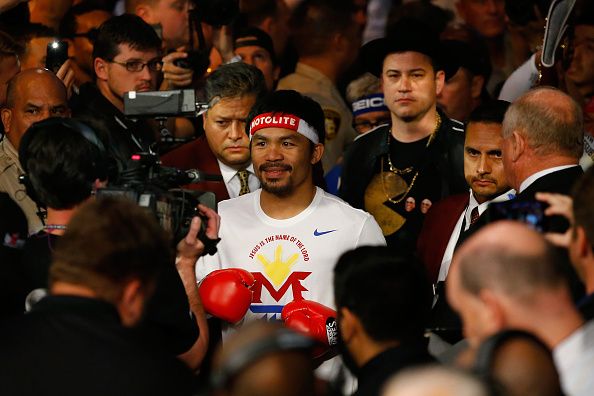 LAS VEGAS, NV - MAY 02:  Manny Pacquiao walks to the ring with Jimmy Kimmel before his welterweight unification championship bout against Floyd Mayweather Jr. on May 2, 2015 at MGM Grand Garden Arena in Las Vegas, Nevada.  (Photo by Al Bello/Getty Images)