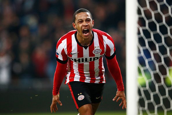 EINDHOVEN, NETHERLANDS - DECEMBER 17:  Memphis Depay of PSV Eindhoven celebrates scoring his teams winning goal in the final minute of the game during the Eredivisie match between PSV Eindhoven and Feyenoord Rotterdam held at the Philips Stadion on December 17, 2014 in Eindhoven, Netherlands.  (Photo by Dean Mouhtaropoulos/Getty Images)