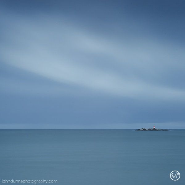 Dalkey Island Lighthouse stands isolated in the sea waiting to provide its guiding light to passing ships.