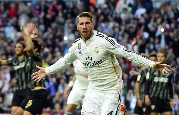 Real Madrid's defender Sergio Ramos celebrates after scoring during the Spanish league football match Real Madrid CF vs Malaga FC at the Santiago Bernabeu stadium in Madrid on April 18, 2015.   AFP PHOTO/ GERARD JULIEN        (Photo credit should read GERARD JULIEN/AFP/Getty Images)