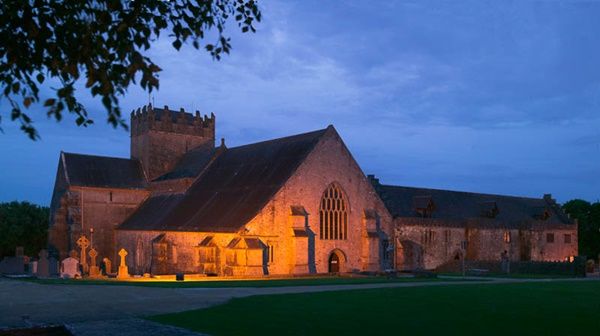 Midlands of Ireland: Tipperary: Holycross Abbey.  A photograph taken at dusk of the 14th Century Cistercian Abbey at Holycross.