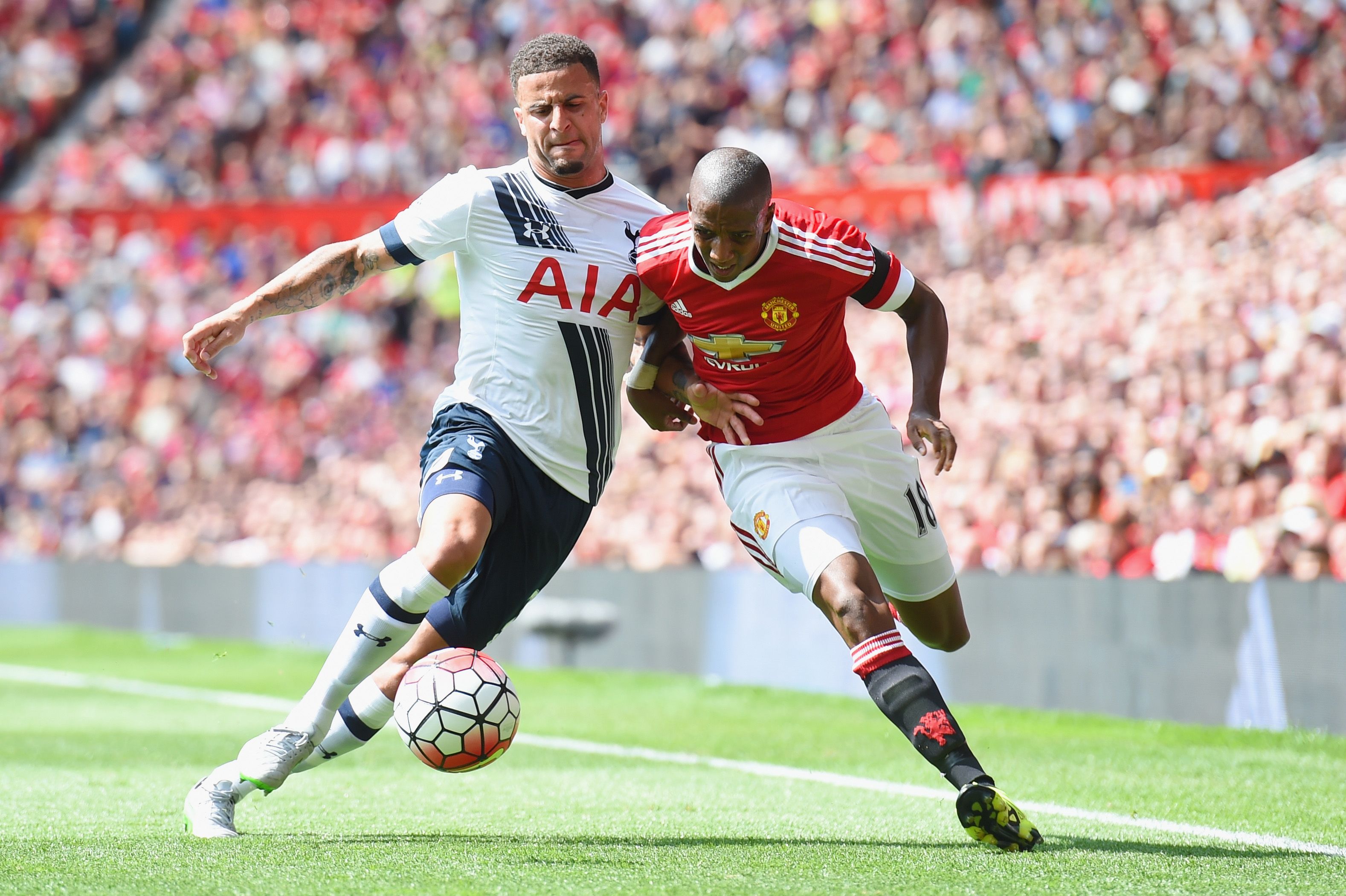 MANCHESTER, ENGLAND - AUGUST 08: Kyle Walker of Tottenham and Ashley Young of Manchester United in action during the Barclays Premier League match between Manchester United and and Tottingham Hotspur at Old Trafford, Manchester. (Photo by Michael Regan/Getty Images)