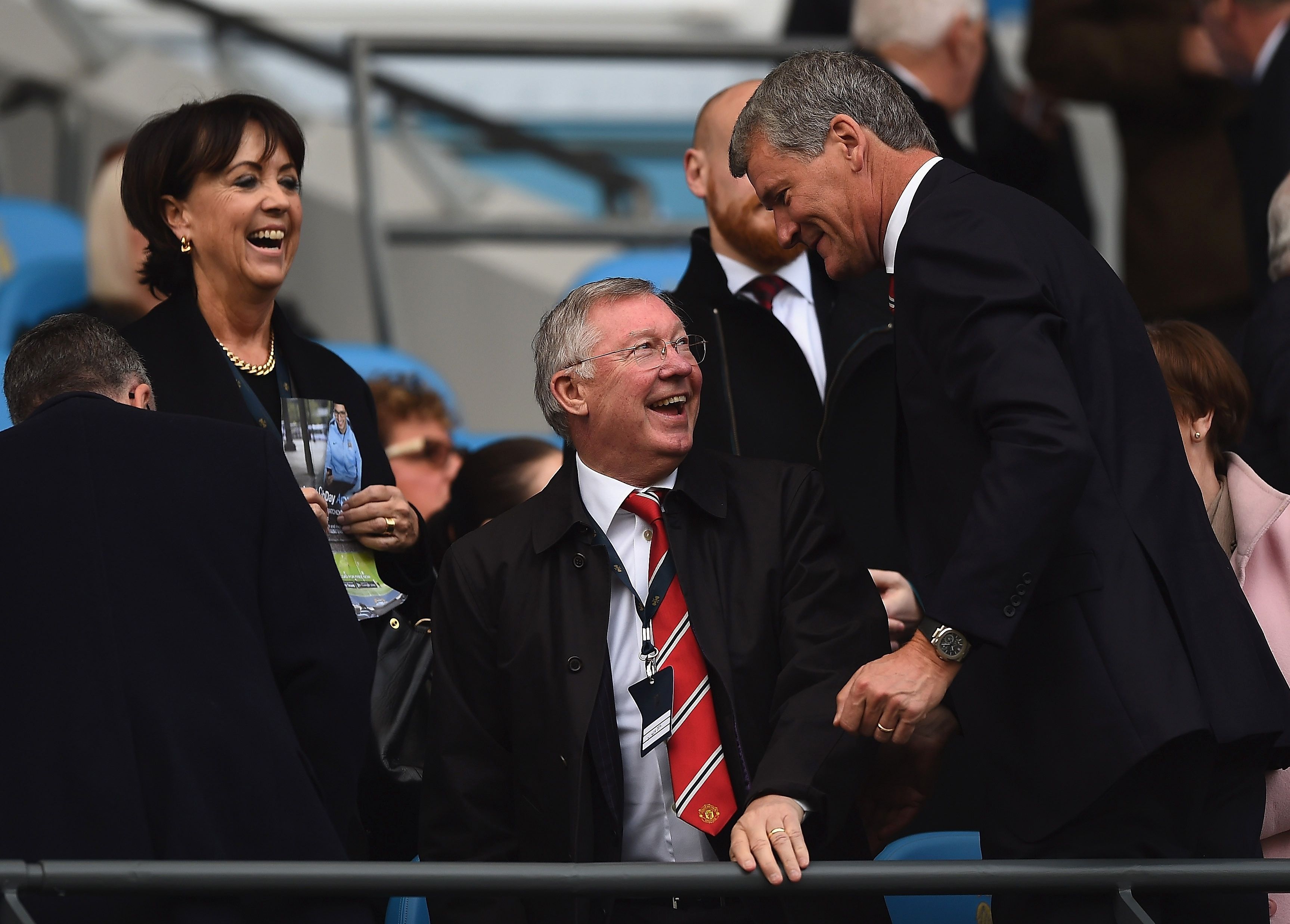 MANCHESTER, ENGLAND - NOVEMBER 02: Sir Alex Ferguson (C) smiles at David Gill, former chief executive of Manchester United during the Barclays Premier League match between Manchester City and Manchester United at Etihad Stadium on November 2, 2014 in Manchester, England. (Photo by Laurence Griffiths/Getty Images)