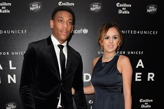 Manchester United's French striker Anthony Martial (L) and his and his wife Samantha pose for pictures on the red carpet as they arrive to attend the "United for UNICEF Gala Dinner" at Old Trafford in Manchester, north-west England, on November 29, 2015. AFP PHOTO / OLI SCARFF / AFP / OLI SCARFF (Photo credit should read OLI SCARFF/AFP/Getty Images)