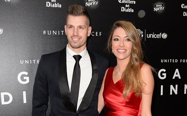 Manchester United's French midfielder Morgan Schneiderlin (L) and his girlfriend Camille Sold pose for pictures on the red carpet as they arrive to attend the "United for UNICEF Gala Dinner" at Old Trafford in Manchester, north-west England, on November 29, 2015. AFP PHOTO / OLI SCARFF / AFP / OLI SCARFF (Photo credit should read OLI SCARFF/AFP/Getty Images)
