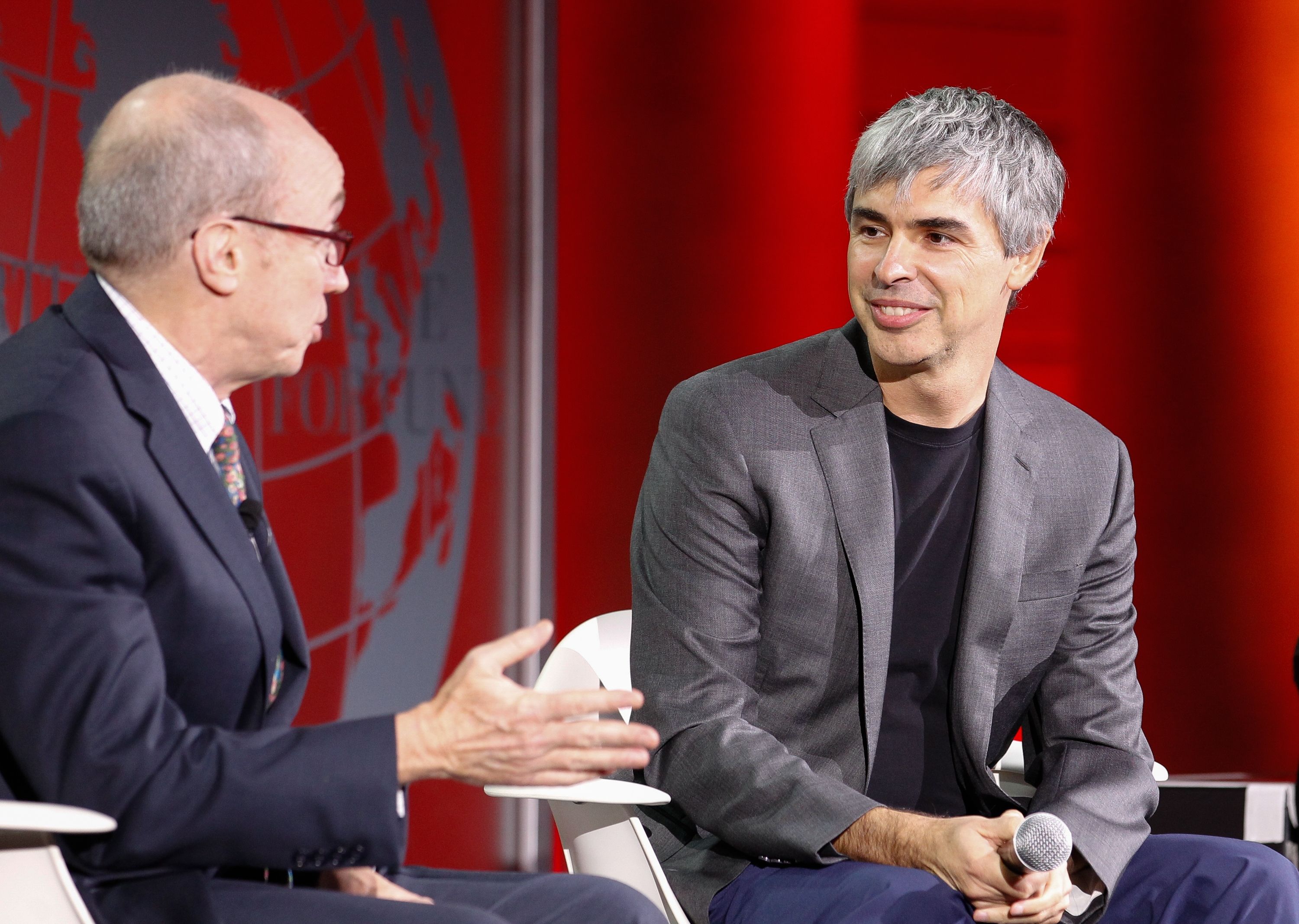 SAN FRANCISCO, CA - NOVEMBER 02: Larry Page (R) and Alan Murray speak during the Fortune Global Forum at the Legion Of Honor on November 2, 2015 in San Francisco, California. (Photo by Kimberly White/Getty Images for Fortune)