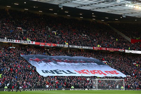 MANCHESTER, ENGLAND - JANUARY 31: Manchester United fans hold up a banner in memory of the Munich air disaster during the Barclays Premier League match between Manchester United and Leicester City at Old Trafford on January 31, 2015 in Manchester, England. (Photo by Alex Livesey/Getty Images)