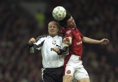 5 Apr 1997: Roy Keane (right) of Manchester United in an airiel challenge with Robin van der laan of Derby County during the Premier League match at Old Trafford, Manchester. Derby won 3-2. Mandatory Credit: Shaun Botterill /Allsport