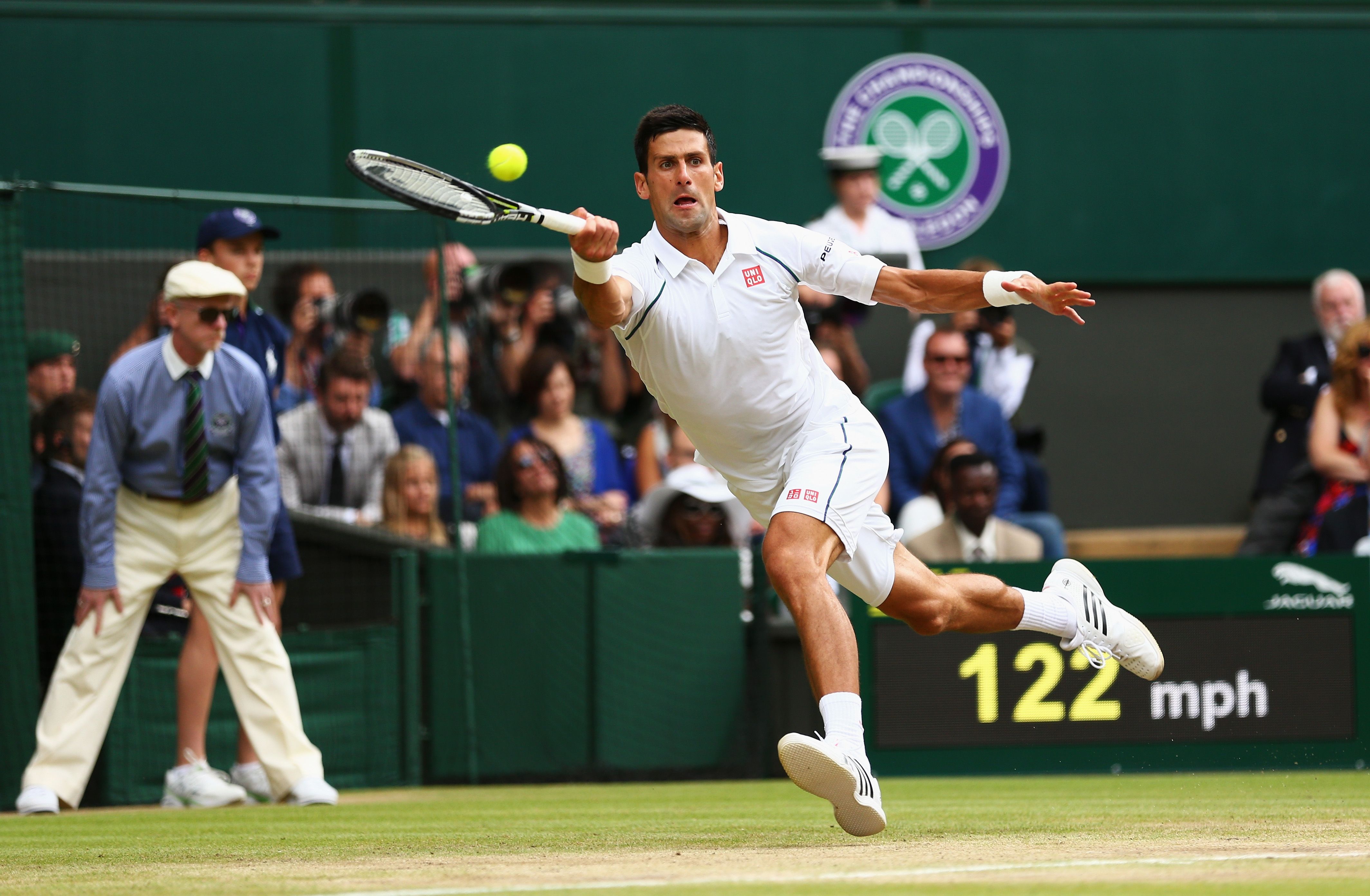 LONDON, ENGLAND - JULY 12: Novak Djokovic of Serbia plays a forehand in the Final of The Gentlemen's Singles against Roger Federer of Switzerland on day thirteen of the Wimbledon Lawn Tennis Championships at the All England Lawn Tennis and Croquet Club on July 12, 2015 in London, England. (Photo by Clive Brunskill/Getty Images)