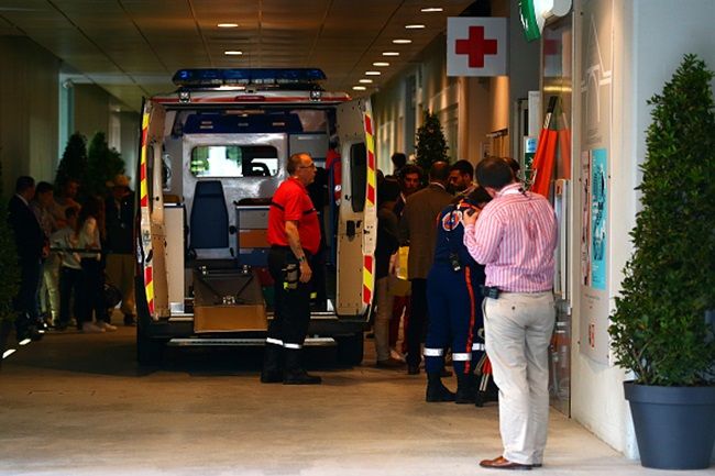PARIS, FRANCE - JUNE 02: An ambulance waits to transport an injured spectator to hospital after a piece of the scoreboard above Court Philippe Chatrier was blown off in high winds during the men's singles quarterfinal match between Kei Nishikori of Japan and Jo-Wilfried Tsonga of France on day of the 2015 French Open at Roland Garros on June 2, 2015 in Paris, France. (Photo by Dan Istitene/Getty Images)