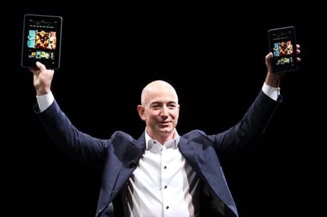 SANTA MONICA, CA - SEPTEMBER 6: Amazon CEO Jeff Bezos holds up the new Kindle Fire HD reading device in two sizes during a press conference on September 6, 2012 in Santa Monica, California. Amazon unveiled the Kindle Fire HD in 7 and 8.9-inch sizes, with prices starting at $199. (Photo by David McNew/Getty Images)