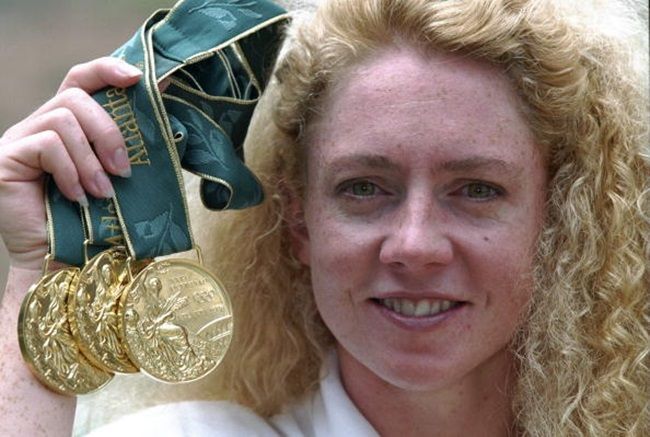 25 Jul 1996: Michelle Smith of Ireland shows off her three gold medals won at the 1996 Centennial Olympic Games in Atlanta, Georgia.