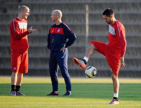 PRETORIA, SOUTH AFRICA - JUNE 22: Clint Demspey of US national football team controls the ball as teammate Michael Bradley talks with his father Bob Bradley, head coach of the team, during training session at Eersterust Stadium on June 22, 2010 in Eersterust east of Pretoria, South Africa. US will play their next World Cup Group C match against Algeria at Loftus Versfeld Stadium in Pretoria, South Africa, on Wednesday June, 23, 2010. (Photo by Kevork Djansezian/Getty Images)