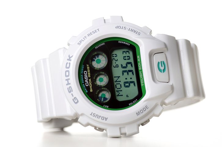 "Kuala Lumpur, Malaysia - June, 20 2011: Picture of CASIO G-SHOCK limited edition aGreen collectionaA Series on white background"